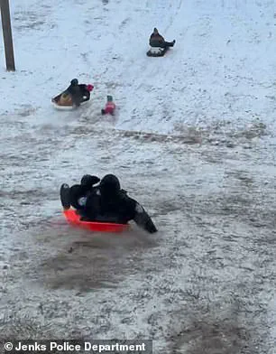 Viral Footage Shows Oklahoma Police Officer Accidentally Sledding Into Child During Snow Day