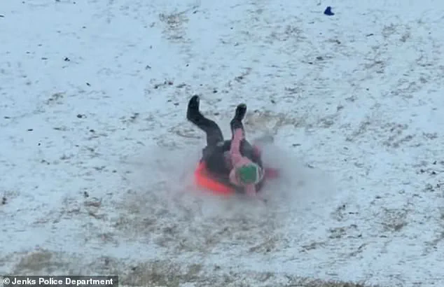 Viral Footage Shows Oklahoma Police Officer Accidentally Sledding Into Child During Snow Day