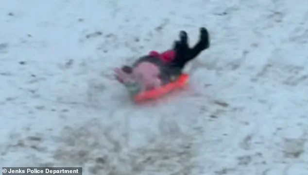 Viral Footage Shows Oklahoma Police Officer Accidentally Sledding Into Child During Snow Day