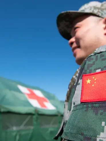Chinese Coast Guard Lands Near Philippine Base in South China Sea