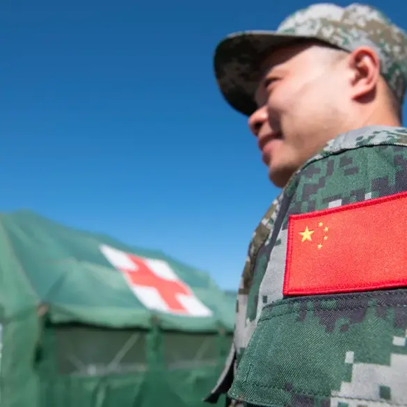 Chinese Coast Guard Lands Near Philippine Base in South China Sea