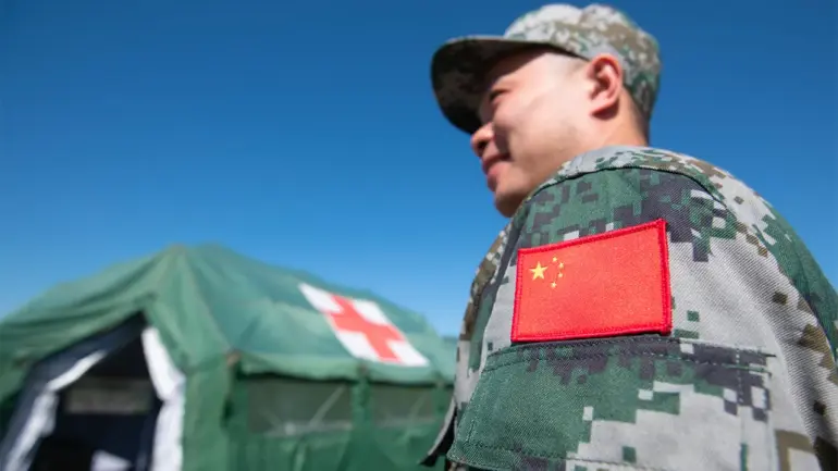 Chinese Coast Guard Lands Near Philippine Base in South China Sea
